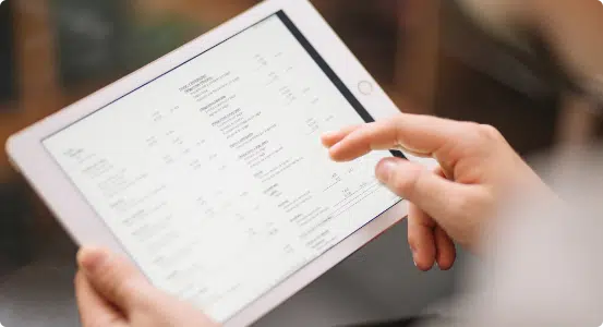crop-employee-using-tablet